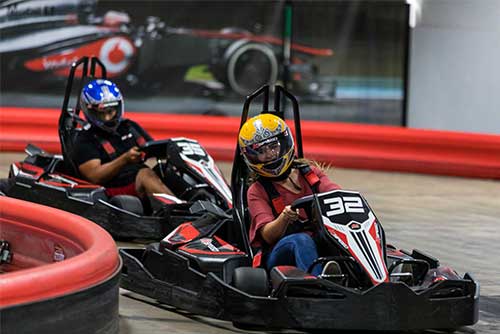 two people race go karts at k1 speed