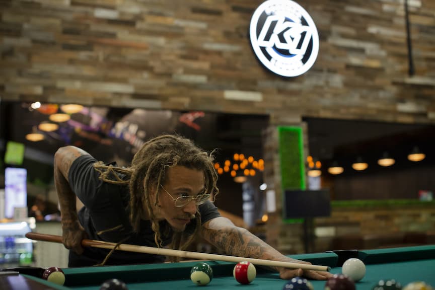 Man plays billiards at K1 Speed Irvine