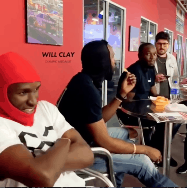 Will Claye crosses his arms while racing with Usain Bolt at K1 Speed in Miami