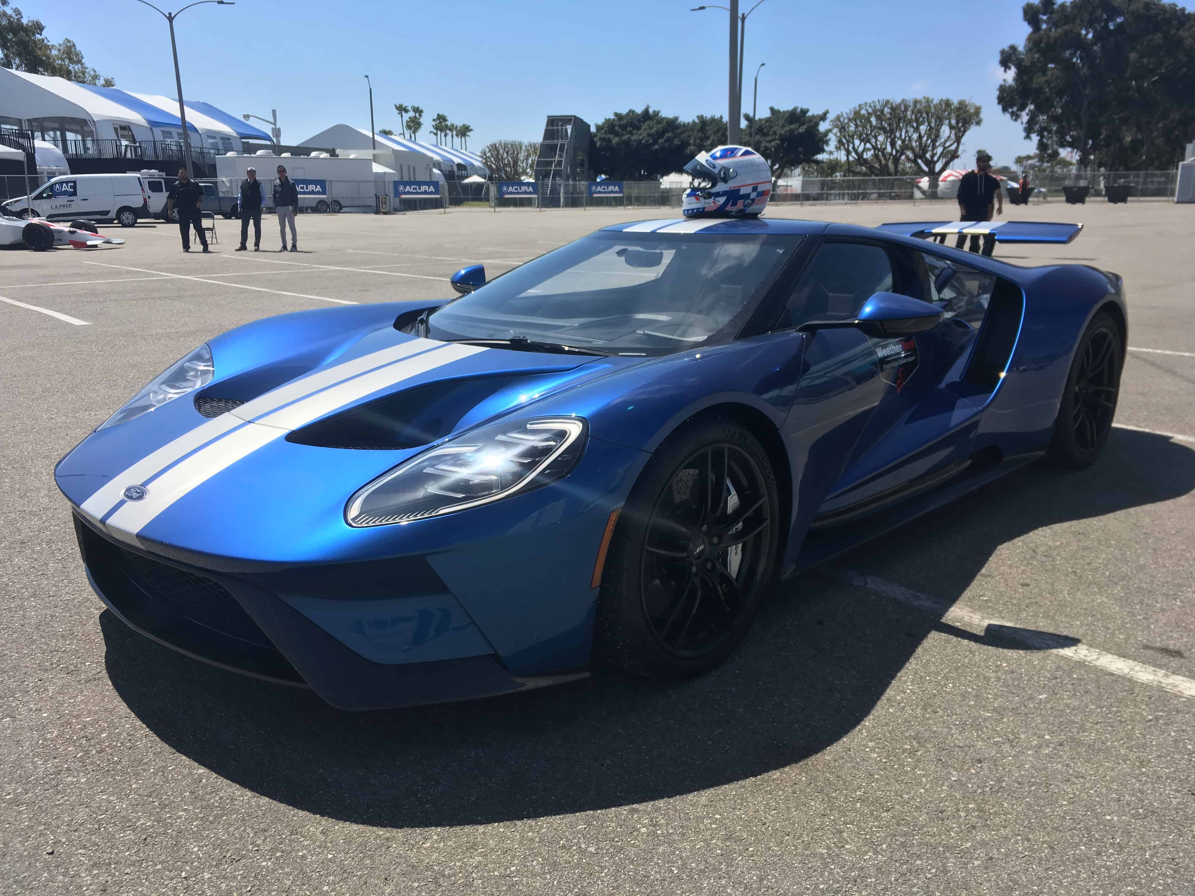 a blue ford gt sits at long beach with joey hand's helmet on top
