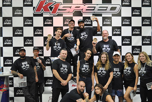 group of people at k1 speed podium