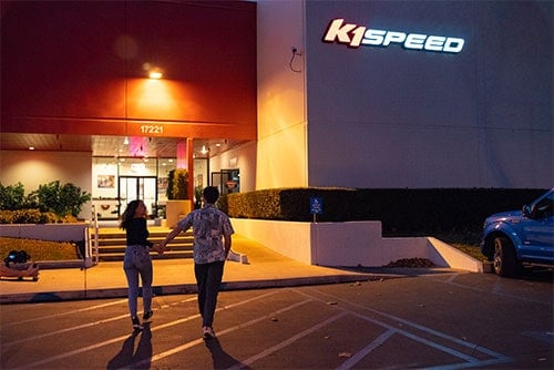 couple walking into a k1 speed building