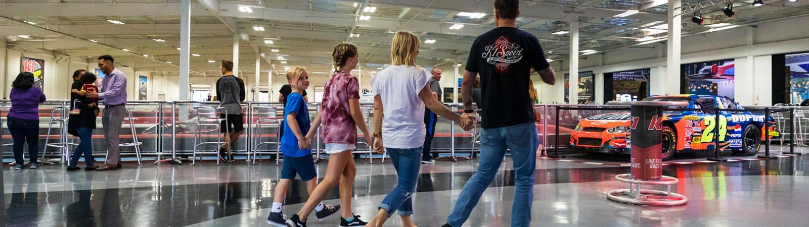 family walking into K1 Speed