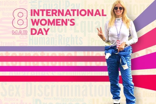 featured image for international womens day with cofounder standing and giving a peace sign