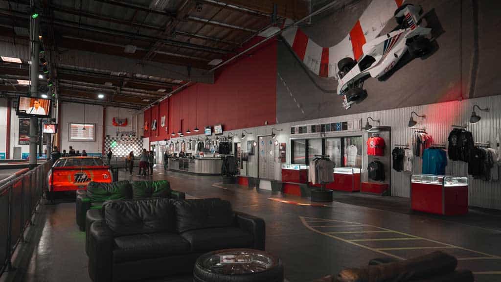 an f1-style car hangs on the wall at k1 speed irvine
