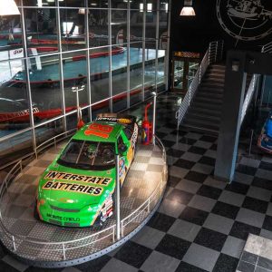 a NASCAR vehicle sits on display in the lobby of K1 Speed Sacramento