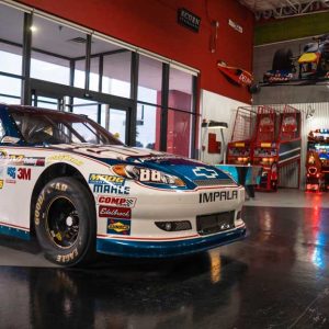 an authentic nascar racecar sits on display in the lobby at k1 speed san antonio