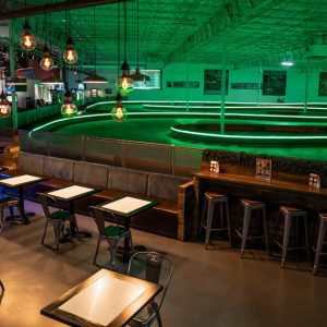 the indoor track at k1 speed san antonio lit by led lights