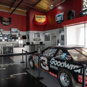 a Dale Earnhardt NASCAR vehicle sits on display near the front counter of K1 Speed Torrance