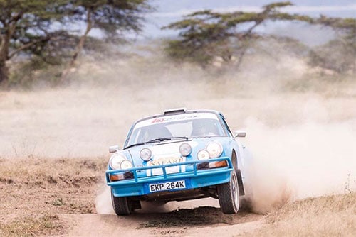 Featured image for the african safari blog featuring porsche 911 racing on dirt