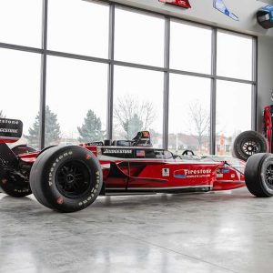 a Champ Car sits in the lobby at k1 speed canton