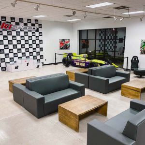 the lobby inside k1 speed richmond featuring an indycar