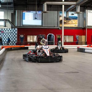 a go kart races on the track at k1 speed corona