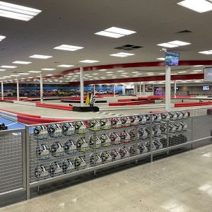 rows of helmets, indoor track, and go karts at k1 speed clovis