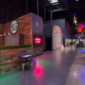 paddock lounge, neon sign, and podium at k1 speed boise