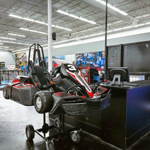 An electric go kart sits on display at k1 speed horsham