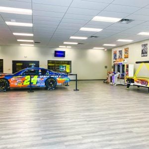 the lobby inside K1 Speed Daytona Beach featuring a Jeff Gordon NASCAR vehicle