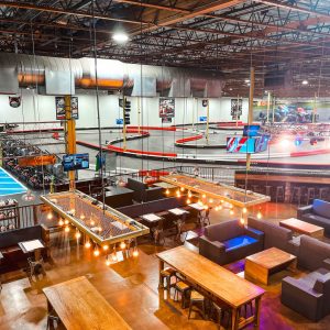 an overhead shot of k1 speed las vegas featuring the paddock lounge and indoor go kart track