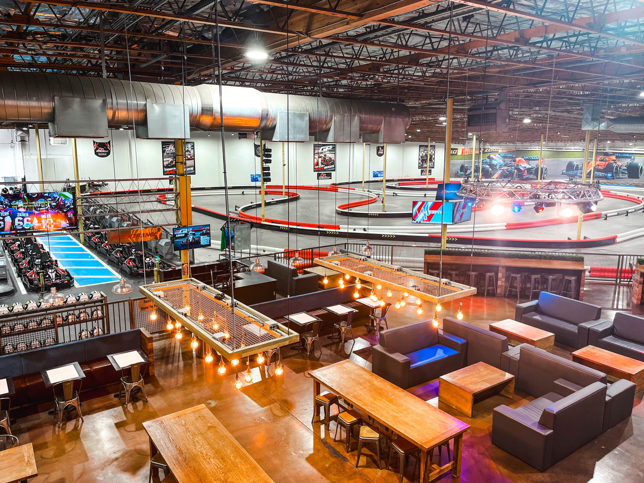 An overhead view of the dining area, pit lane, and race track.
