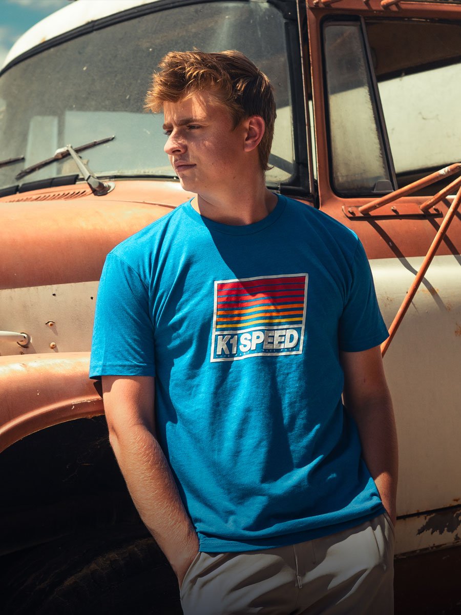 blue k1 speed t-shirt guy leaning against truck