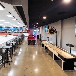 a shuffleboard and pool tables sit near the track at k1 speed clovis