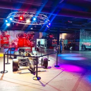 the lobby at k1 speed phoenix featuring an indycar on display