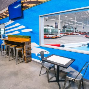 a window looks onto the track from the lobby at k1 speed chula vista