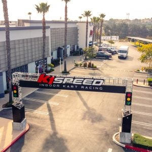 an f1-style grid light trussing is constructed over the parking lot entrance to k1 speed chula vista