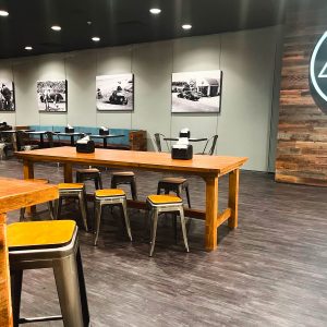 the paddock lounge inside k1 speed daytona beach with black and white images from daytona beach's racing history