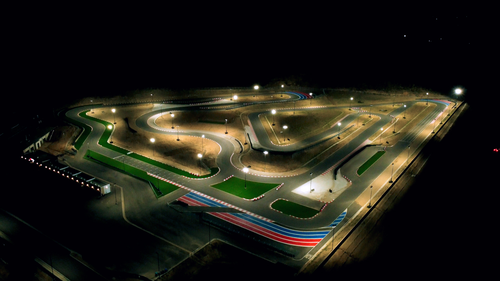 aerial shot of k1 circuit at night flooded with lights