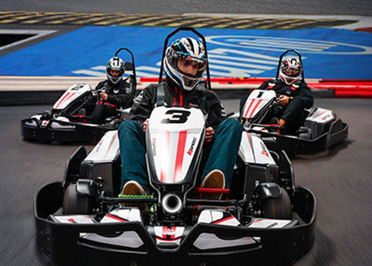 three go karts on a track