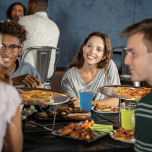 teens eating pizza at K1 Speed