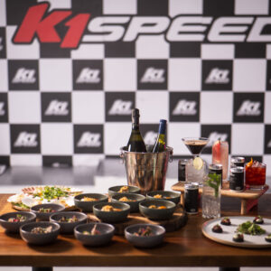 a display of food and beverages in front of the k1 speed podium in canary wharf, london