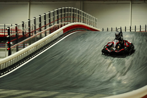 A racer goes down the elevated track at K1 Speed Le Mans.