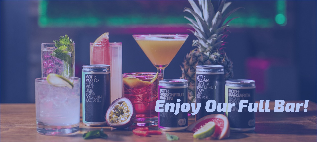 a selection of cocktails and canned drinks at the paddock lounge in canary wharf