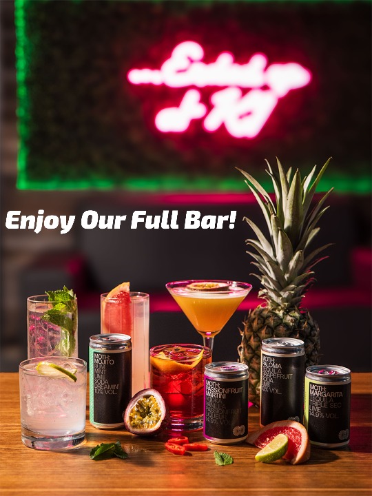 a selection of cocktails and canned drinks at the paddock lounge in canary wharf