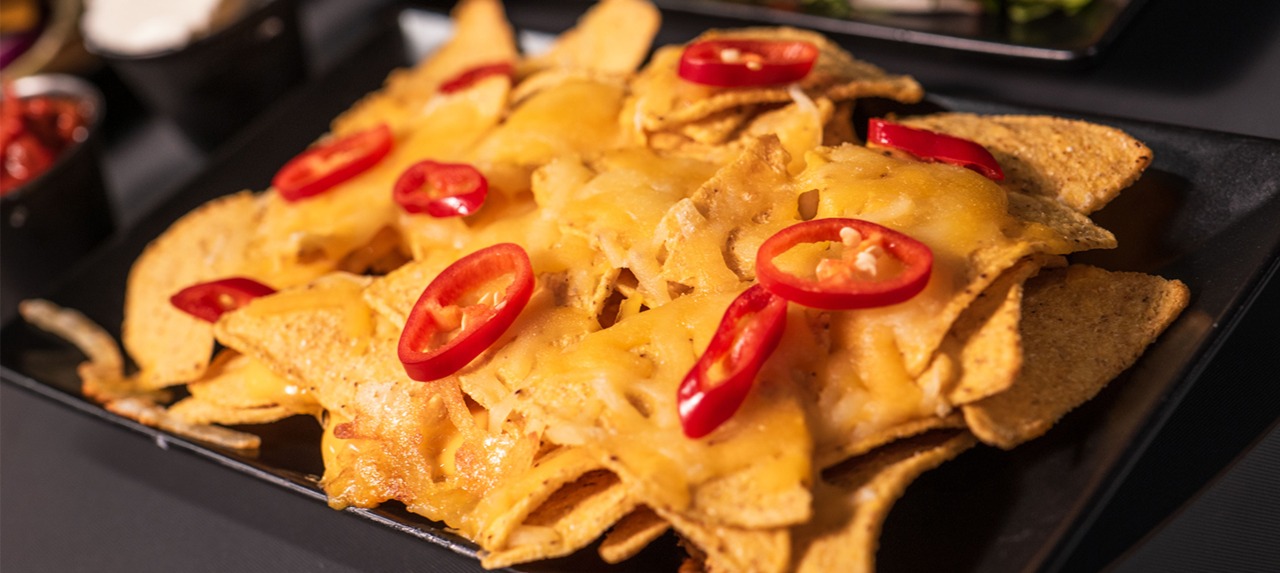 a close up shot of nachos