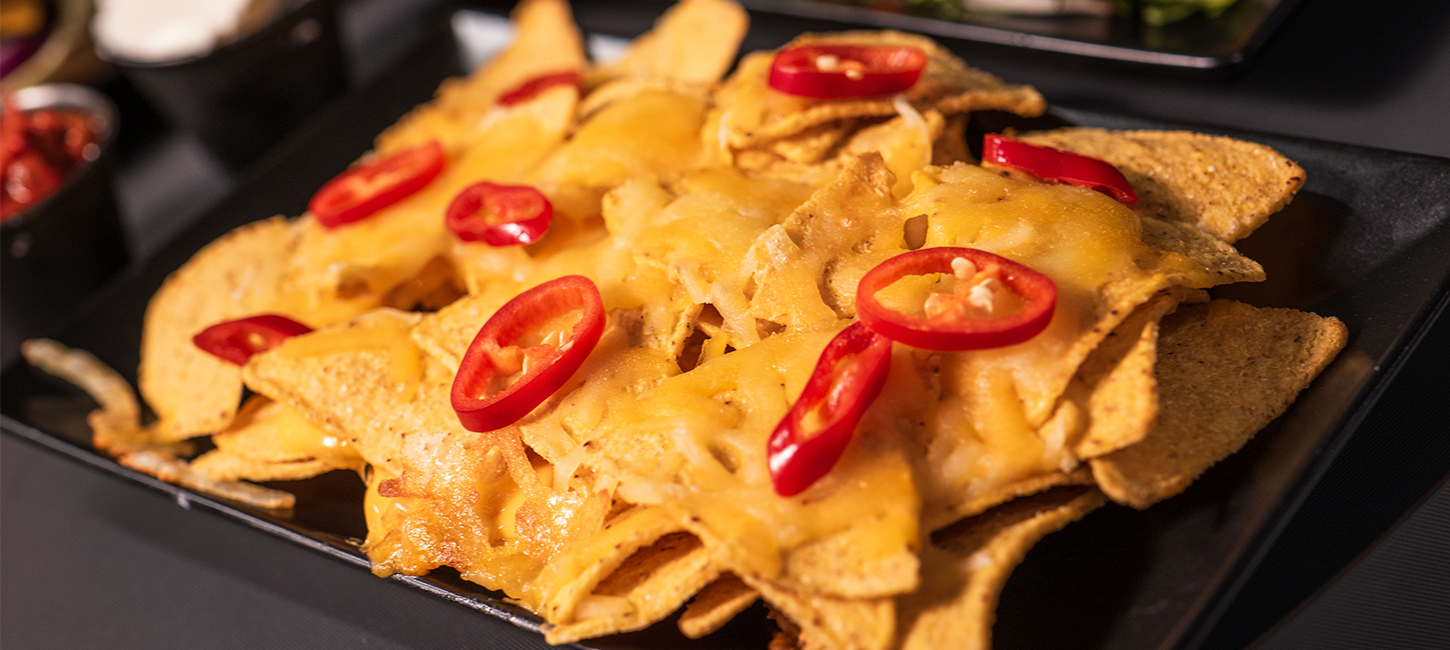 a close up shot of nachos