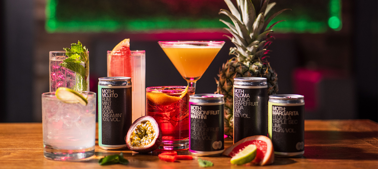 a selection of cocktails and canned drinks at the paddock lounge in canary wharf