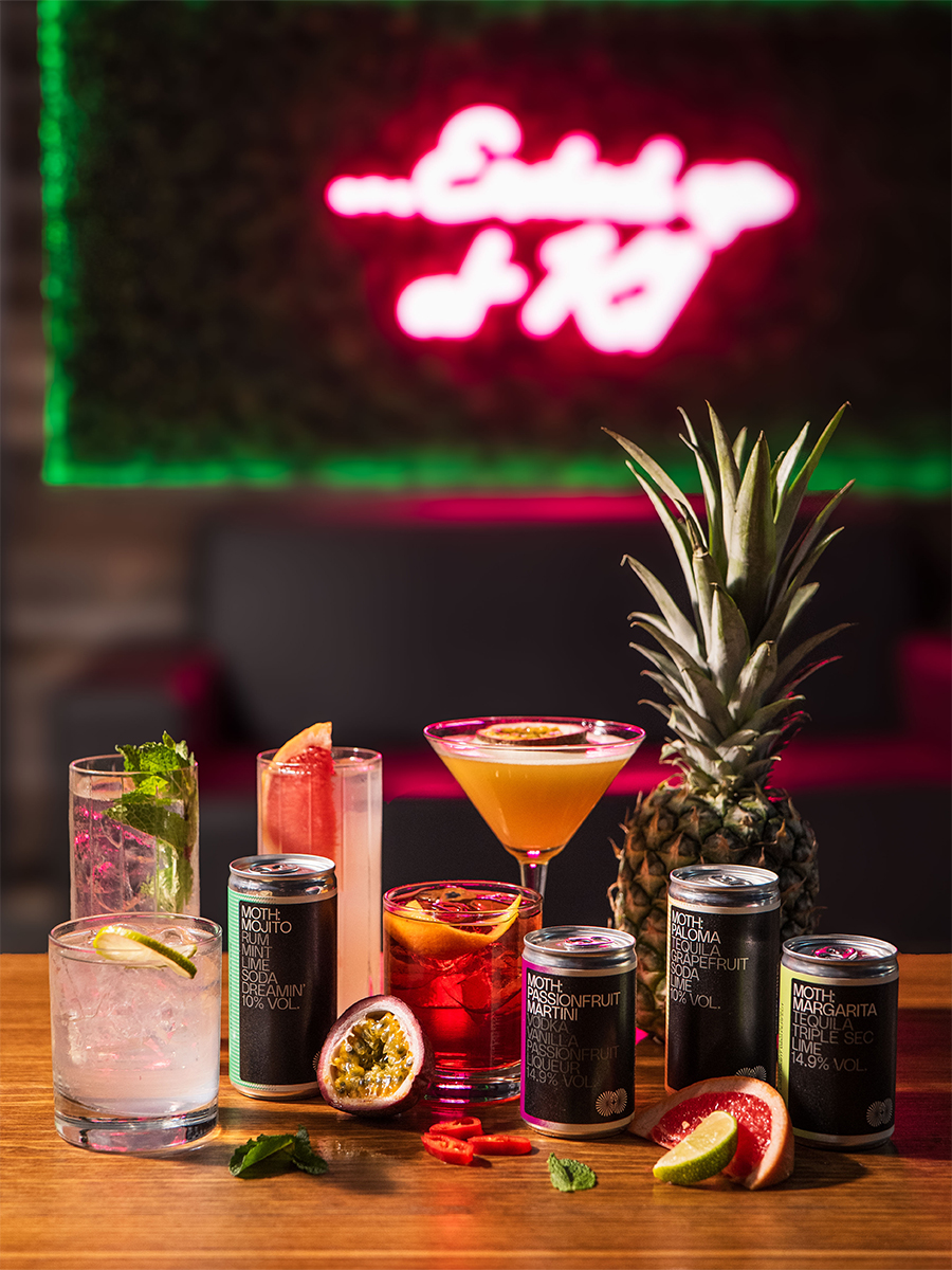 a selection of cocktails and canned drinks at the paddock lounge in canary wharf