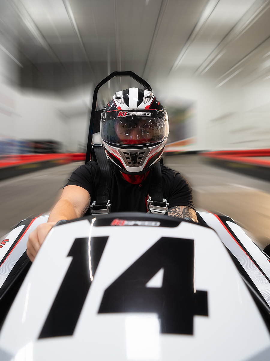 head-on image of a person racing a go kart