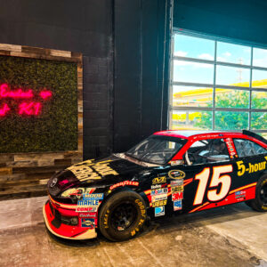 a NASCAR car sits on display at k1 speed the woodlands
