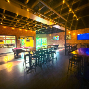 Dining tables inside K1 Speed Jacksonville's Paddock Lounge