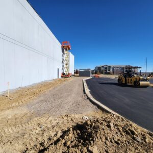 Side of building and paved road near K1 Speed Thornton