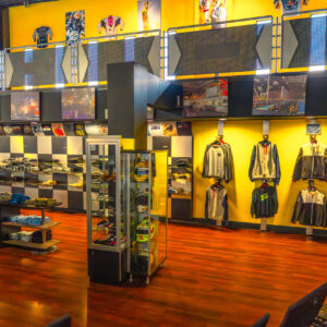The lobby wall lined with merchandise at K1 Speed Sacramento.