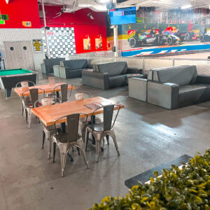 Paddock Lounge and trackside seating, with the podium in the background.