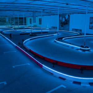 the track inside k1 speed thousand oaks with barriers that are lined with led lights