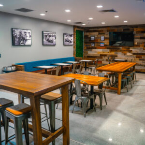 Seating area and TV at K1 Speed's Paddock Lounge inside its Culver City location