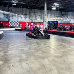 A racer on the indoor go karting track at K1 Speed Jessup.