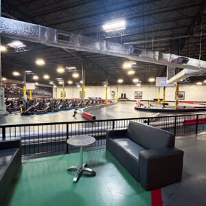 A trackside view of the pit lane and indoor go karting track at K1 Speed Jessup.
